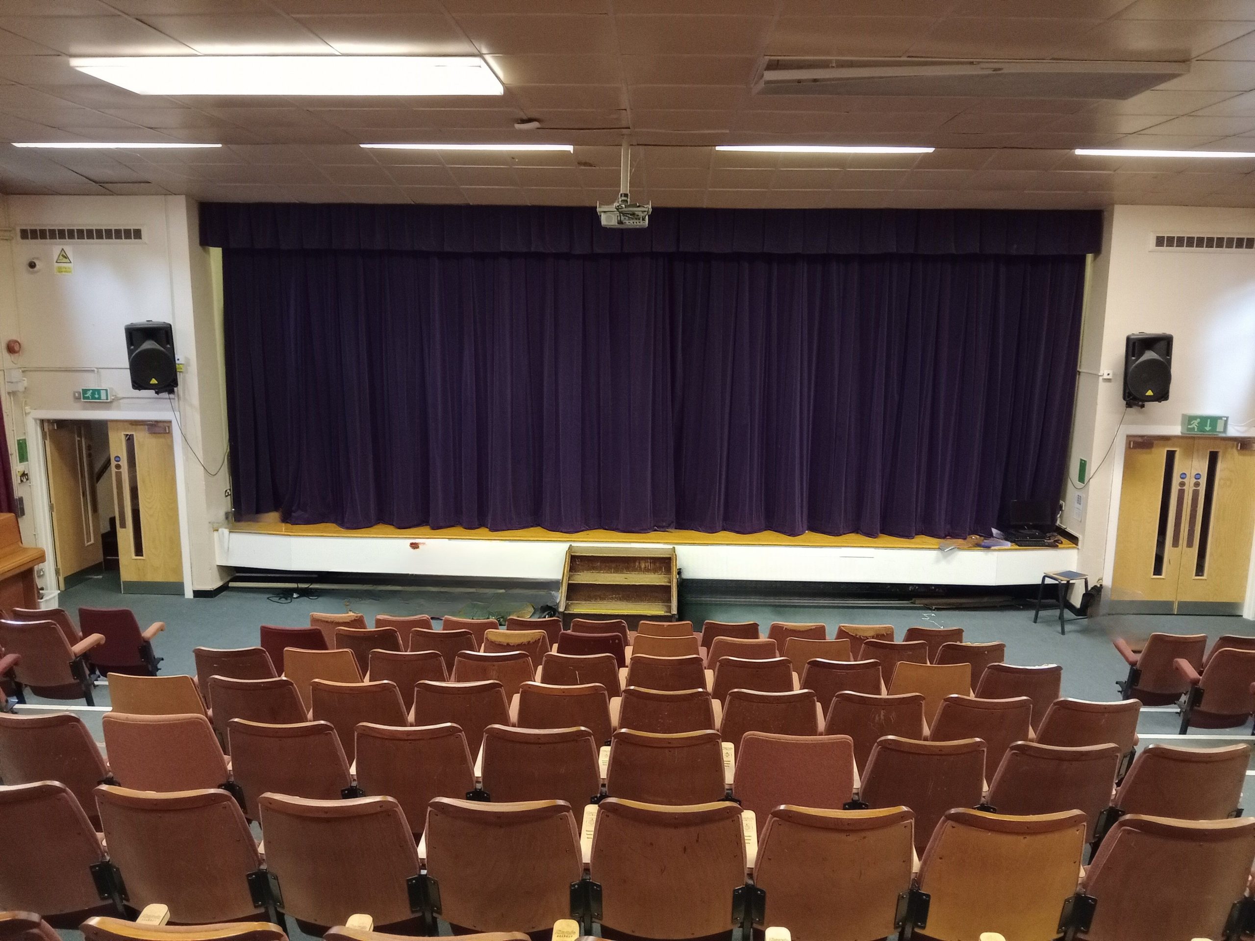 Looking from the back row of a theatre towards the stage