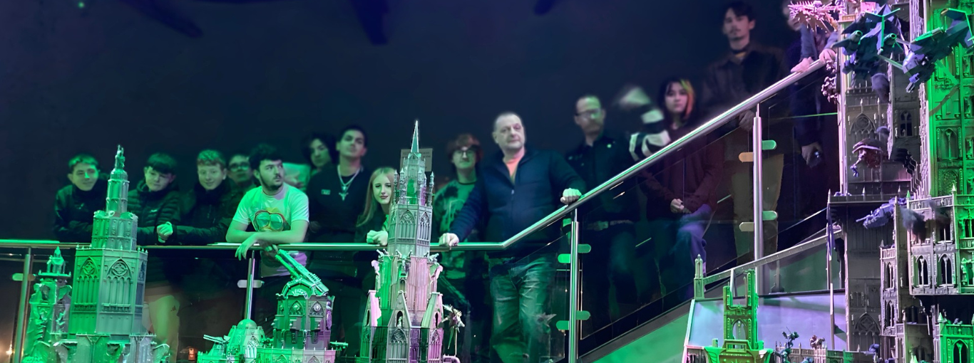 Students standing behind a Warhammer display
